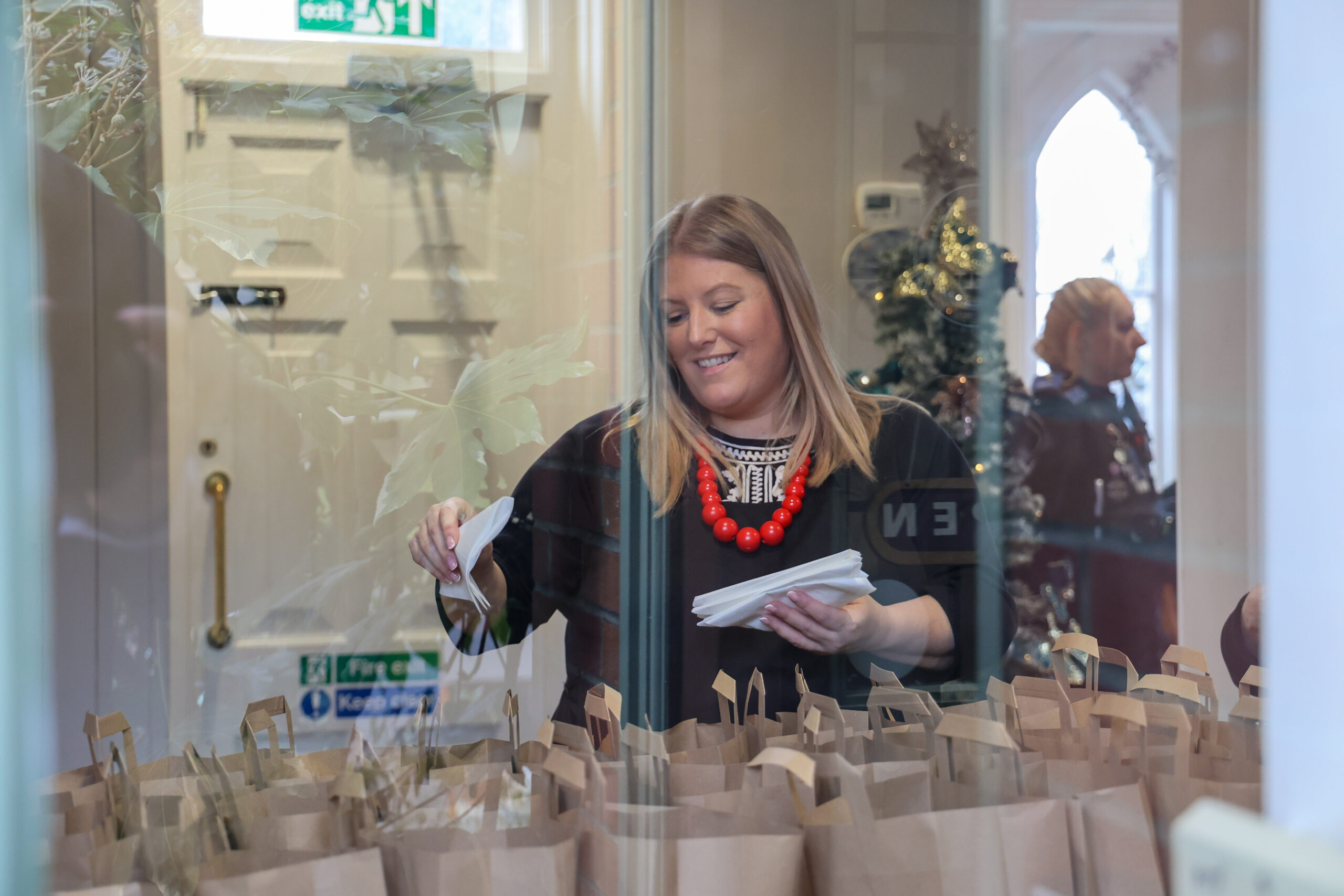 PCC Donna Jones helping to pack the food bags for the homeless in Portsmouth